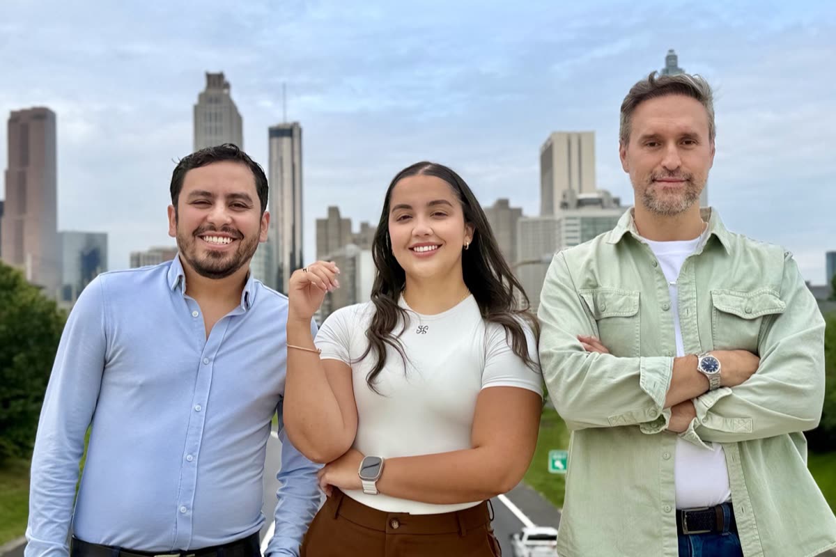 The Steady Coverage team in front of the Atlanta skyline
